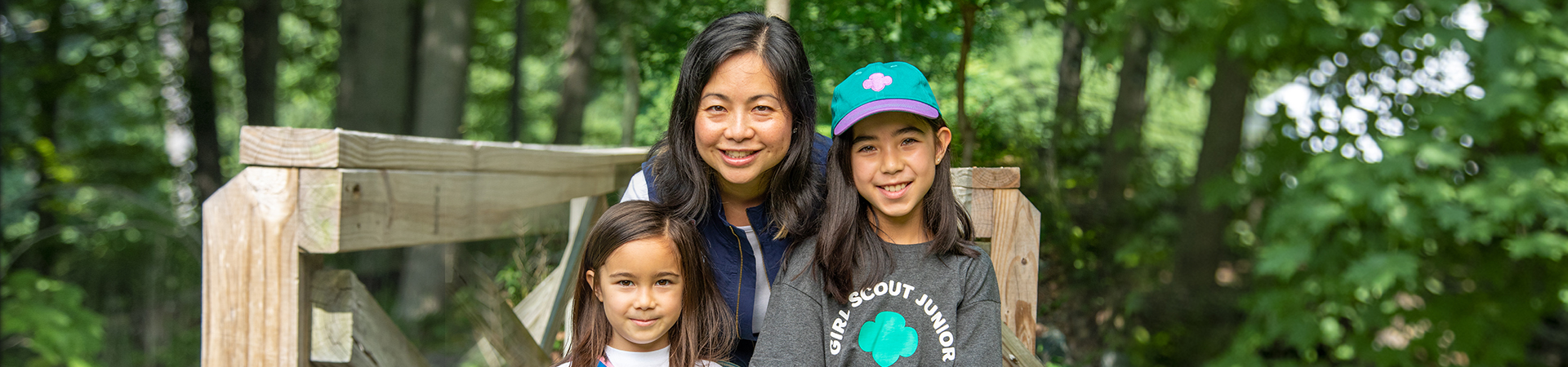  adult woman girl scout volunteer outdoors smiling 